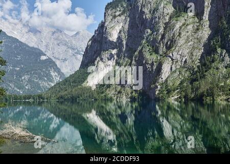 Scenic view of Obersee and alpine landscape with mountains reflecting in the lake in Schoenau, Germany Stock Photo