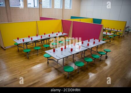 Lunch spaces for different classes separated and spaced as The Charles Dickens Primary School in London prepares to safely welcome back pupils. Stock Photo
