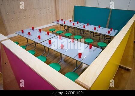 Lunch spaces for different classes separated and spaced as The Charles Dickens Primary School in London prepares to safely welcome back pupils. Stock Photo