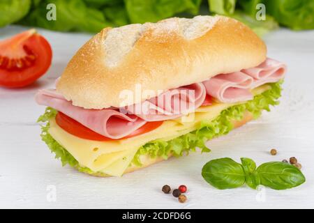 Sub sandwich with ham and cheese on wooden board wood Stock Photo