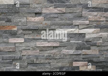 Stone wall cladding, stacked horizontal strips of stone Stock Photo