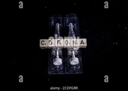 Bamberg, Deutschland. 27th Aug, 2020. Bamberg, Germany August 28, 2020: Symbols - Coronavirus - 08/28/2020 Vaccine with syringe and Corona | usage worldwide Credit: dpa/Alamy Live News Stock Photo