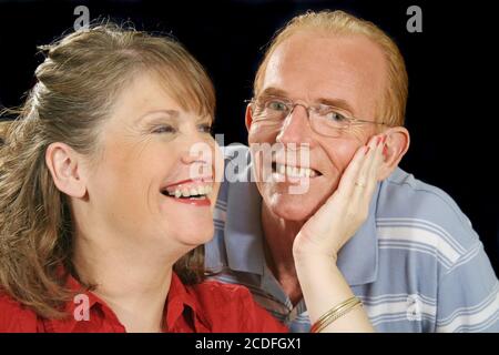 Middle Aged Couple Holding Stock Photo