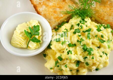 Scrambled Eggs With Butter And Toast Stock Photo