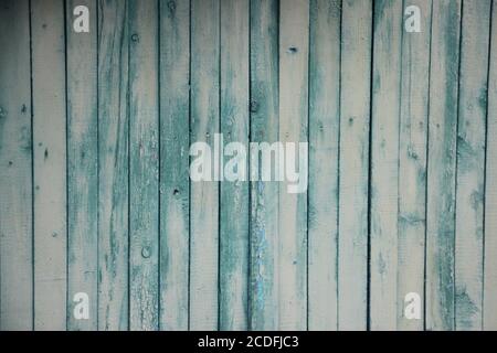 old wooden weathered planks painted into green with horizontal boards Stock Photo