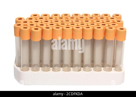 test tubes with orange covers in rack isolated on white Stock Photo