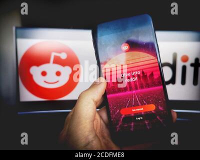 Reddit app smartphone reddit logo screen background . Stock Photo