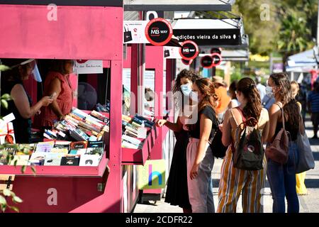 Lisbon, Portugal. 27th Aug, 2020. People wearing face masks as a preventive measure during the Lisbon Book Fair 2020 in Lisbon, Portugal.The 90th edition of the Lisbon Book Fair, originally scheduled for May/June, kicked off on Aug. 27 due to the COVID-19 pandemic. Credit: SOPA Images Limited/Alamy Live News Stock Photo