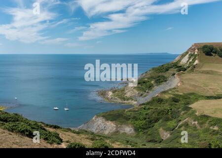 View looking down into 'Chapman's Pool' in the Isle of Purbeck Dorset, seen from Emmett's Hill, with a view of Portland on the horizon to west. Stock Photo