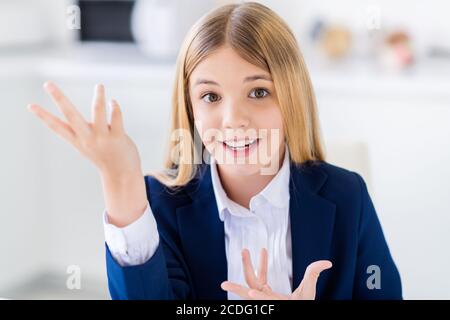 Close-up portrait of her she nice attractive brainy cheerful knowledgeable small little schoolchild girl explaining example exercise solution future Stock Photo