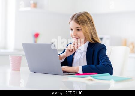 Close-up portrait of her she nice attractive pretty smart clever brainy focused cheerful small little long-haired girl watching web classes tutorial Stock Photo