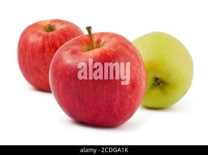 Two red and one green apples on white Stock Photo