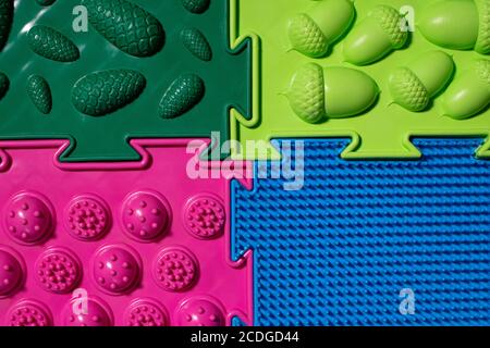 Orthopedic mats view from above. Bright colorful multicolored mats to prevent flat feet and foot massage. Stock Photo