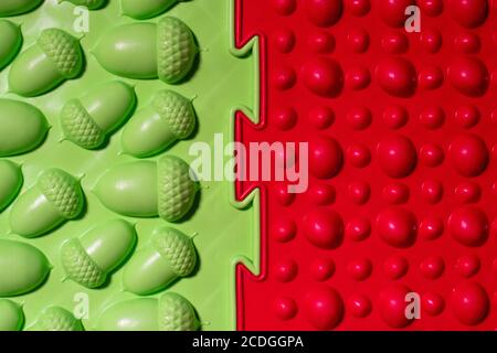 Orthopedic mats view from above. Bright colorful multicolored mats to prevent flat feet and foot massage. Stock Photo