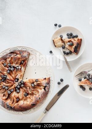 Apple pie with blueberries shot from above on a white background Stock Photo