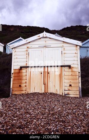 Old weathered grim seaside beach hut in miserable weather Stock Photo