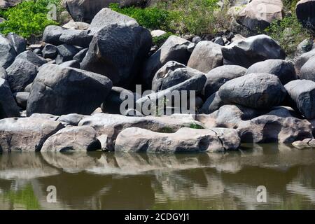 rock pattern and reflection at hampi karnataka abstract photo Stock Photo