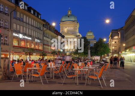 BERN, SWITZERLAND - JUNE 23: Barenplatz, with the Swiss Parliament Building looming over the square in Bern, Switzerland on June 23, 2012. Barenplatz Stock Photo