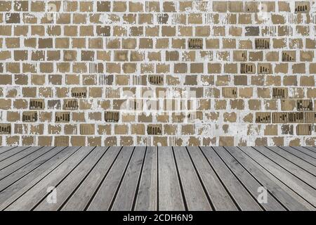 Closeup of a wooden table against a brick wall - perfect for wallpapers Stock Photo