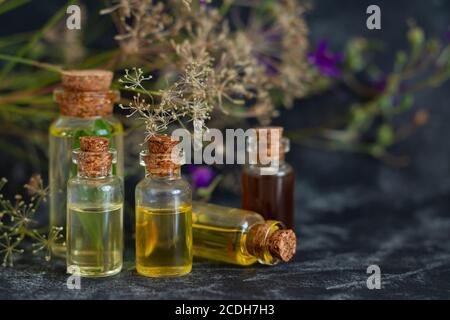 Aromatherapy, spa, massage, skin care and alternative medicine concept. Herbal essential oils in glass bottles Stock Photo