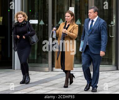 Fiona Donohoe (left), mother of Noah Donohoe, leaving Laganside Court in Belfast with her sister Niamh (centre) and legal representative Niall Murphy (right) of KRW Law, after attending the preliminary inquest into the death of her son at Belfast Coroners Court. Stock Photo