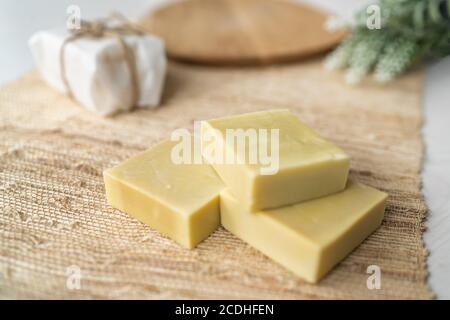 Handmade natural olive oil soap bars DIY homemade soap with lavender essentail oils - activity for what to do inside at home. Top view on decorative Stock Photo