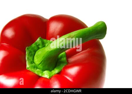 close-up of brightly red pepper with a green pod Stock Photo