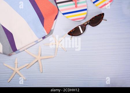flat composition of summer beach accessories on table. Stock Photo