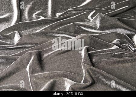 grey glossy velvet is formative folds and light-sh Stock Photo