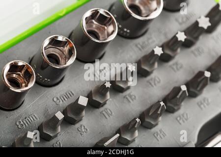 Replacement attachments and bits for repair. Tool box with various heads Stock Photo