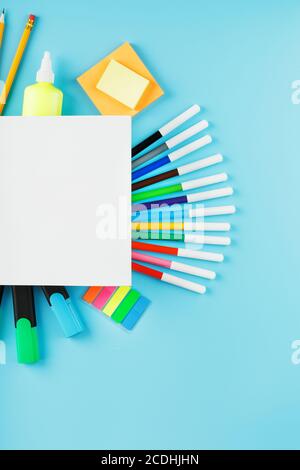 A set of school supplies for learning and creative development on a blue background. Stock Photo