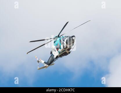 Air Ambulance helicopter turning, registration G-KSSC, model AgustaWestland AW169 in England, UK. Helicopter in a turn. Stock Photo