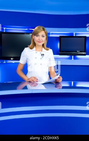 television anchorwoman at TV studio Stock Photo