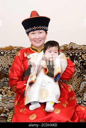 Mongolian woman with baby Stock Photo