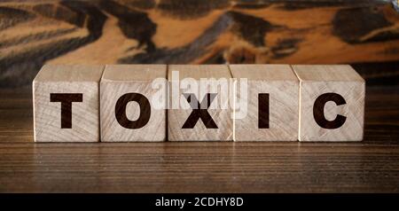 Toxic Word written on wooden cubes. Addiction concept Stock Photo