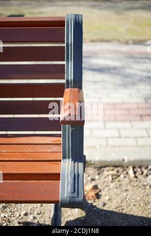 Wooden bench in the city park. Stock Photo