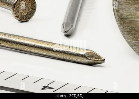 Nails Hammer and Ruler up Close Stock Photo