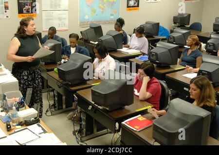 Pine Bluff, AR  October 17, 2006: Community college students learning business administration while working and listening to the instructor in a computer lab. ©Bob Daemmrich Stock Photo