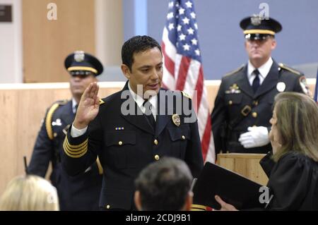Austin, TX July 19, 2007: Public swearing-in ceremony at City Hall for Art Acevedo (l), the first Hispanic police chief in Austin's history.  Acevedo came to Austin from the chief's position in east Los Angeles, CA. ©Bob Daemmrich / Stock Photo