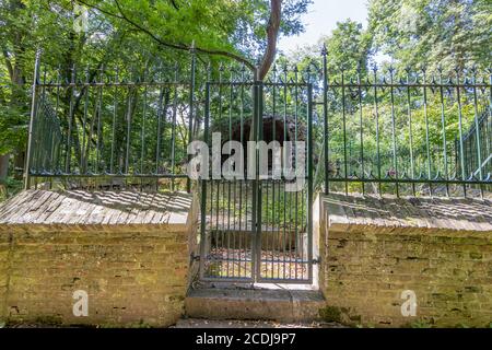 Wrought iron grille surrounding the cave with the representation of Jesus kneeling before an angel in the Garden of Olives (Hof van Olijven) Stock Photo