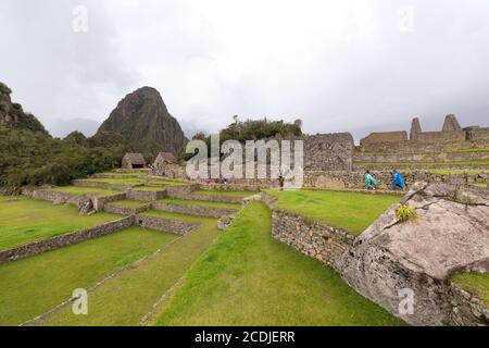 Machu Picchu, Peru - October 06, 2018: View Of Tourists Visiting The 