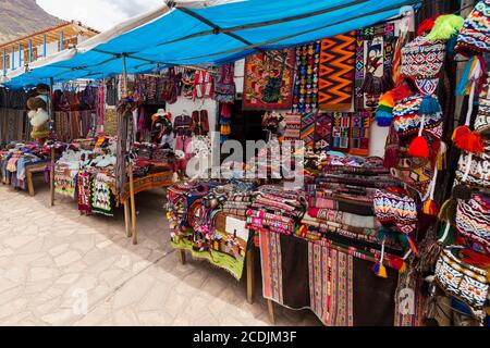 Pisac, Peru - october 09, 2018: Peruvian traditional colourful native handicraft textile fabric at market in Cusco, Peru Stock Photo
