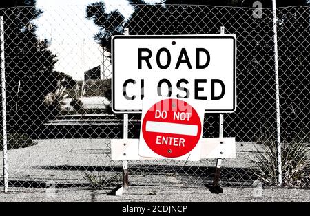 Road Closed Sign Before Chain Link Fence Stock Photo