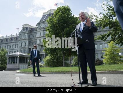 Washington, United States. 28th Aug, 2020. Mark Meadows, White House Chief of Staff, speaks to members of the media following a television interview outside the White House in Washington, DC, U.S., on Friday, August 28, 2020. Meadows stated that the White House has offered House Speaker Nancy Pelosi a $1.3 trillion stimulus package that President Donald Trump would sign today, and stated that the talks remain stalled due to her reluctance to compromise. Photo by Stefani Reynolds/UPI Credit: UPI/Alamy Live News Stock Photo