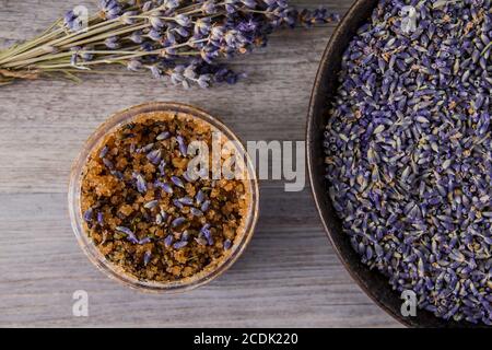 Natural exfoliant with lavender dried flowers, brown sugar and essential oils Stock Photo