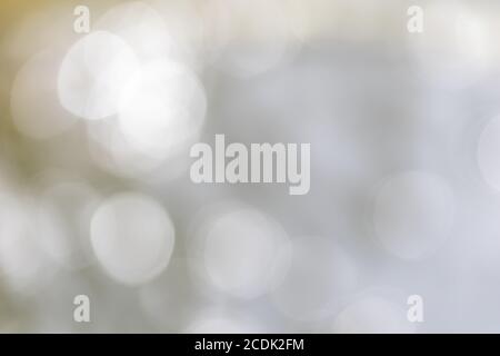 Abstract blurred silver bokeh soft light background and texture. Christmas and Happy new year on blurred bokeh with snowfall banner background. Stock Photo