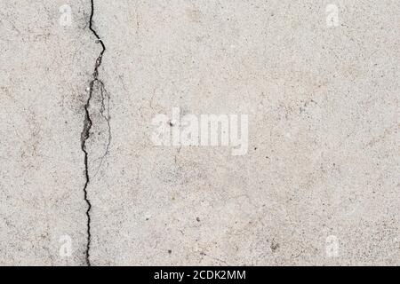 Blank concrete gray rough wall for background with copy space for text. Beautiful grey wall with cracks and dirty. Stock Photo