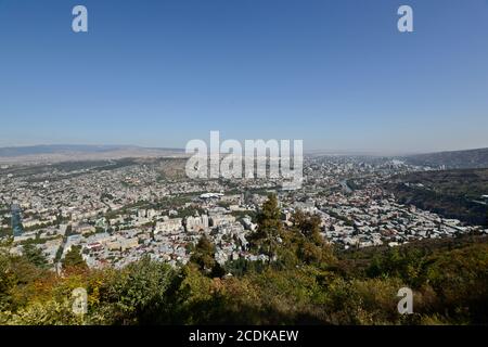 Panoramic view of Tbilisi from Mount Mtatsminda: The Holy Trinity Cathedral of Tbilisi, Kura River, Bridge of Peace. Republic of Georgia Stock Photo