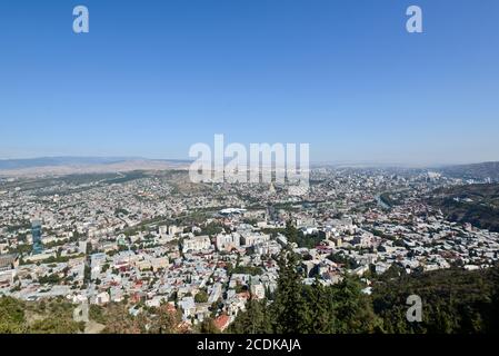 Panoramic view of Tbilisi from Mount Mtatsminda: The Holy Trinity Cathedral of Tbilisi, Kura River, Bridge of Peace. Republic of Georgia Stock Photo