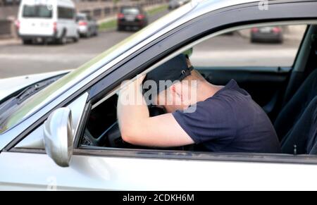 Man fall asleep in the Car Stock Photo